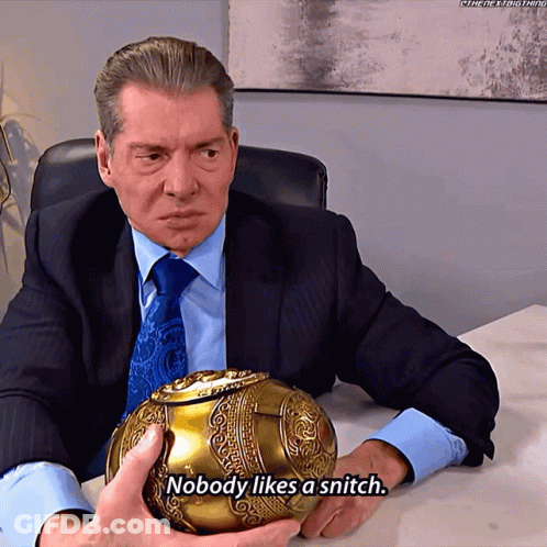 A Man In A Suit And Tie Is Holding A Gold Ball And Says " Nobody Likes A Snitch " GIF