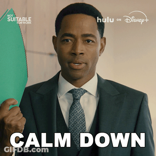A Man In A Suit And Tie Is Holding A Green Folder And The Words Calm Down Are Above Him GIF