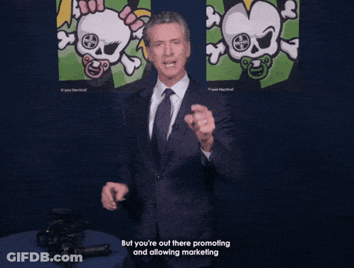 A Man In A Suit And Tie Is Holding A Gun And Says " This Is A Weapon Of War " At The Bottom GIF