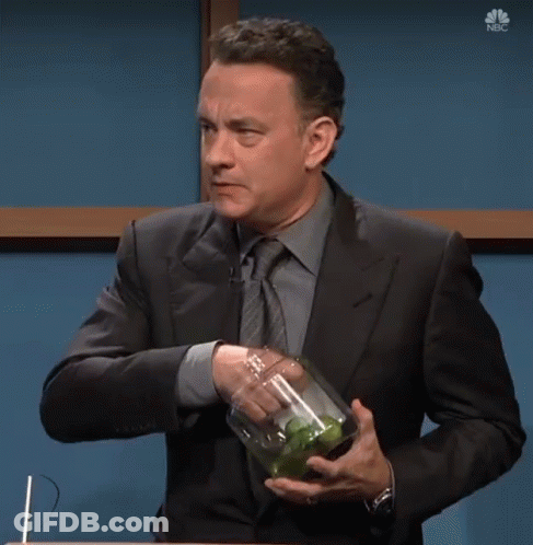 A Man In A Suit And Tie Is Holding A Jar Of Pickles With The Words I Wanted A Pickle Below Him GIF