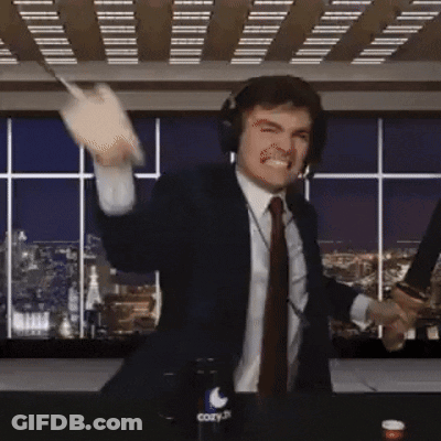 A Man In A Suit And Tie Is Holding A Knife And A Bottle Of Cozy GIF