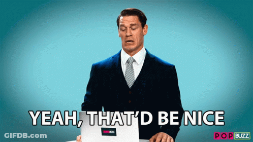 A Man In A Suit And Tie Is Holding A Laptop And Says " Yeah That 'D Be Nice " GIF