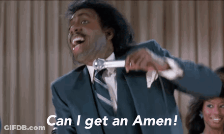 A Man In A Suit And Tie Is Holding A Microphone And Saying Can I Get An Amen ! GIF