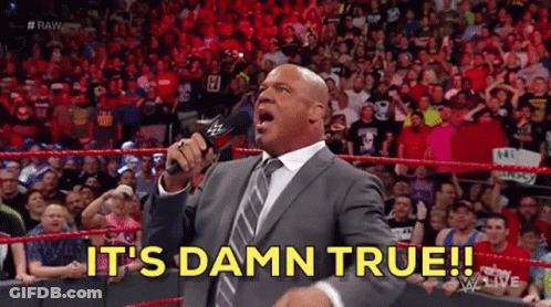 A Man In A Suit And Tie Is Holding A Microphone And Saying It 'S Damn True ! GIF