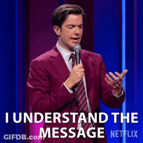 A Man In A Suit And Tie Is Holding A Microphone And Says I Understand The Message Netflix GIF