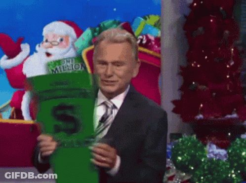 A Man In A Suit And Tie Is Holding A One Million Dollar Socks GIF