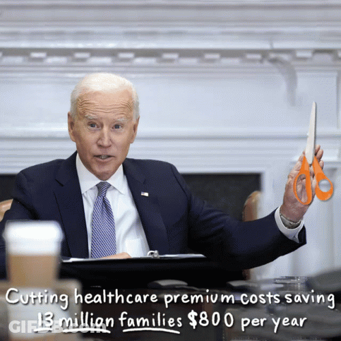 Man In Suit Holding Scissors GIF