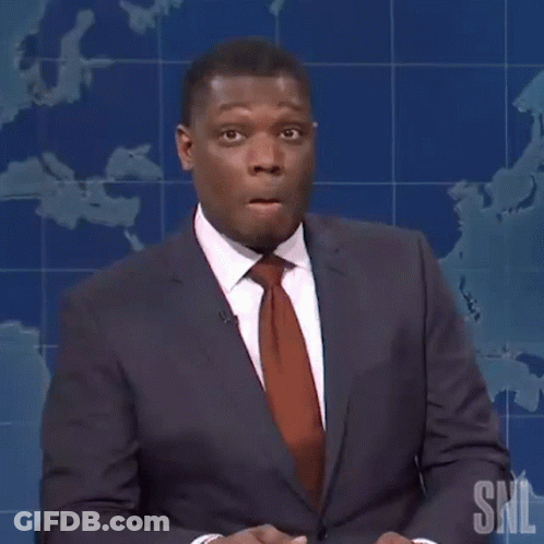 A Man In A Suit And Tie Is Holding A Pencil And Saying Maybe GIF