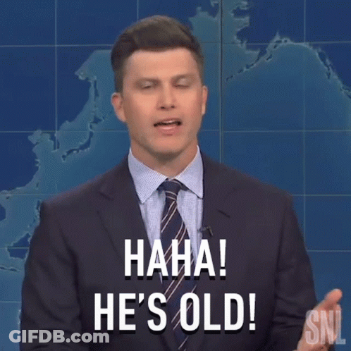 A Man In A Suit And Tie Is Holding A Pencil In His Hand And Saying He 'S Old . GIF