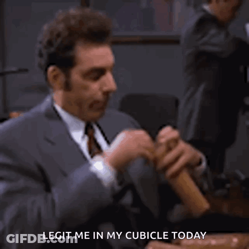 A Man In A Suit And Tie Is Holding A Person 'S Hand And Says `` Legitim Me In My Cubicle Today '' . GIF