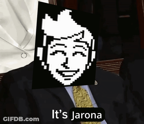 A Man In A Suit And Tie Is Holding A Picture Of A Pixelated Face With The Words It 'S Jarona Underneath It GIF