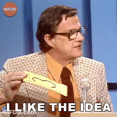 A Man In A Suit And Tie Is Holding A Piece Of Paper That Says " I Like The Idea " On It GIF