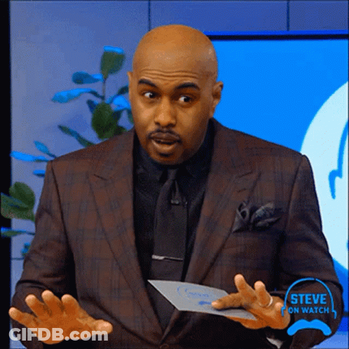 A Man In A Suit And Tie Is Holding A Piece Of Paper That Says Steve On Watch On It GIF