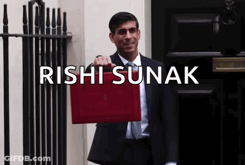 A Man In A Suit And Tie Is Holding A Red Briefcase With The Name Rishi Sunak Written Above Him GIF