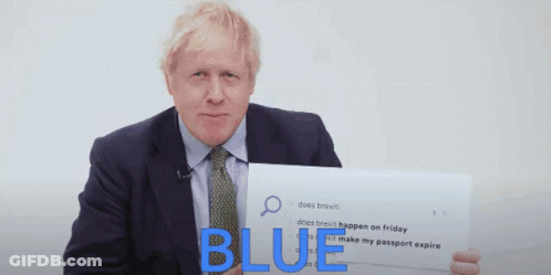 A Man In A Suit And Tie Is Holding A Sign That Says " Blue " GIF