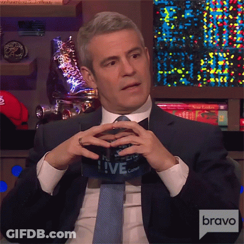 Man In Suit Holding Live Sign GIF
