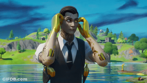 A Man In A Suit And Tie Is Holding His Hands To His Ears GIF