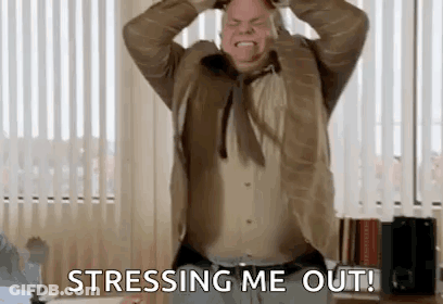 A Man In A Suit And Tie Is Holding His Head In His Hands And Saying `` Stressing Me Out '' . GIF