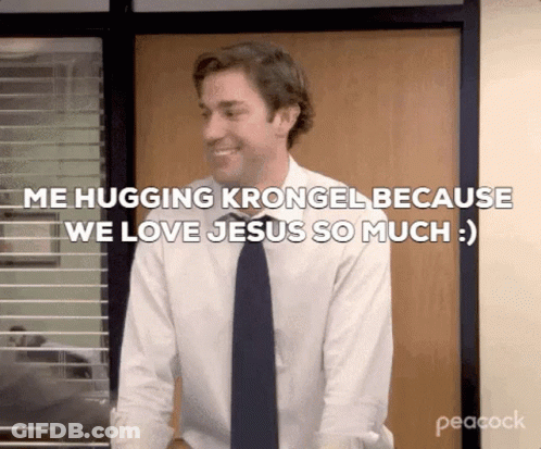 A Man In A Suit And Tie Is Hugging Krongel Because We Love Jesus So Much . GIF