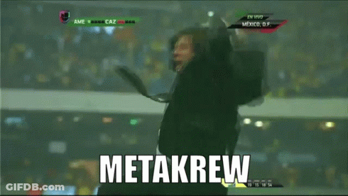 A Man In A Suit And Tie Is Jumping In The Air With The Word Metakrew Written In White GIF