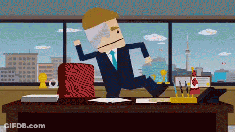 A Man In A Suit And Tie Is Jumping Over A Desk With A Canadian Flag On It GIF