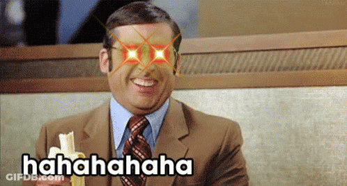 Man In Suit Laughing Holding Banana Hahaha Text GIF