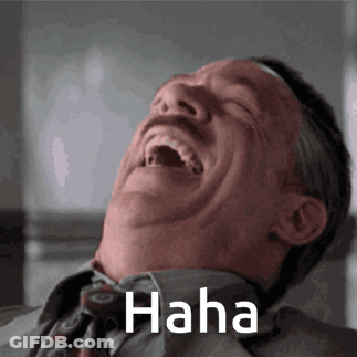 A Man In A Suit And Tie Is Laughing With The Word Haha Written Above Him GIF