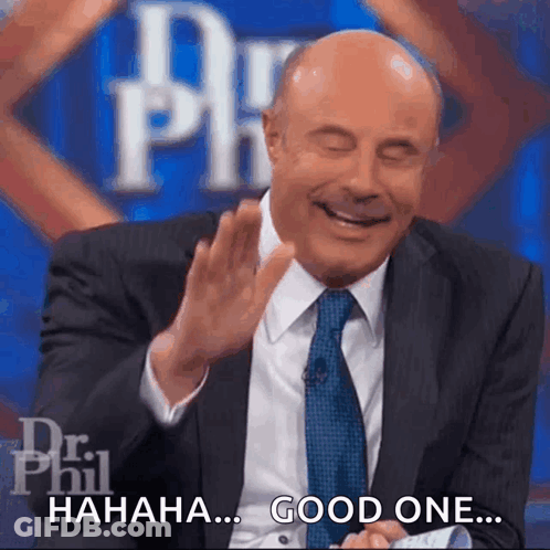 A Man In A Suit And Tie Is Laughing With The Words " Good One " Next To Him GIF