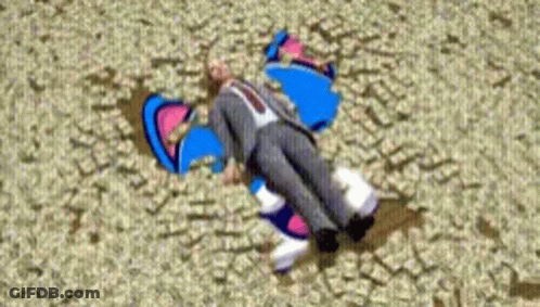 A Man In A Suit And Tie Is Laying On The Ground With A Cartoon Character Behind Him GIF