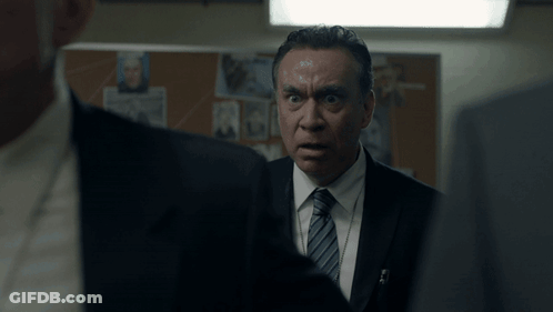 Man In Suit And Tie Looking At Another Man GIF
