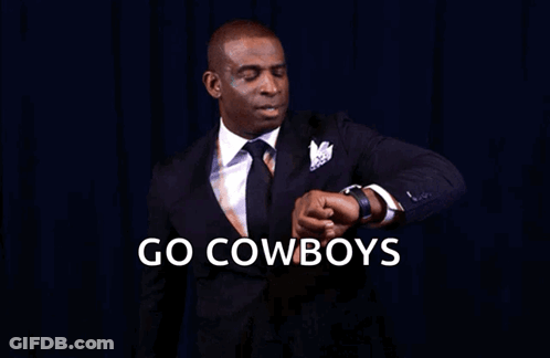 A Man In A Suit And Tie Is Looking At His Watch With The Words Go Cowboys You Know What Time It Is GIF