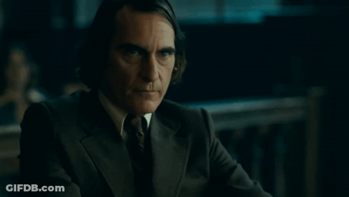 Man In Suit And Tie Looking At Camera GIF