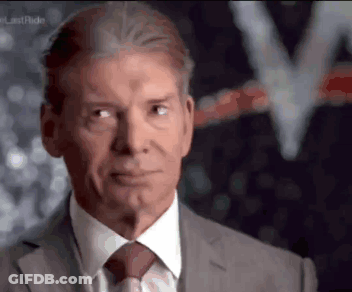 A Man In A Suit And Tie Is Looking To The Side GIF