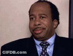 Man Making Funny Face In Suit GIF