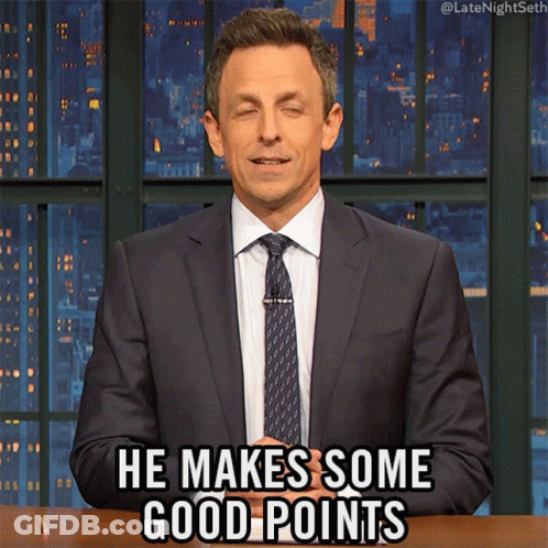 A Man In A Suit And Tie Is Making A Funny Face And Saying He Makes Some Good Points GIF