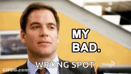 A Man In A Suit And Tie Is Making A Funny Face And Saying `` My Bad , Wrong Spot . '' GIF