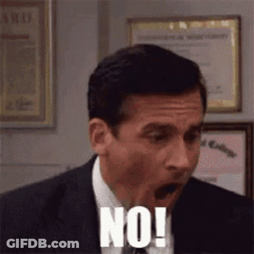 A Man In A Suit And Tie Is Making A Funny Face And Saying No ! GIF