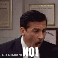 A Man In A Suit And Tie Is Making A Funny Face And Saying No ! GIF