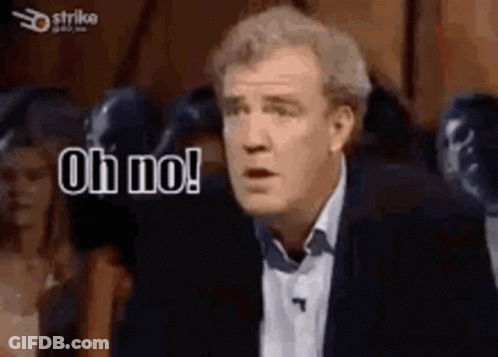 A Man In A Suit And Tie Is Making A Funny Face And Saying `` Oh No ! '' GIF