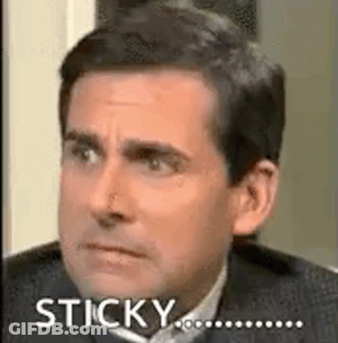 A Man In A Suit And Tie Is Making A Funny Face And Saying Sticky . GIF
