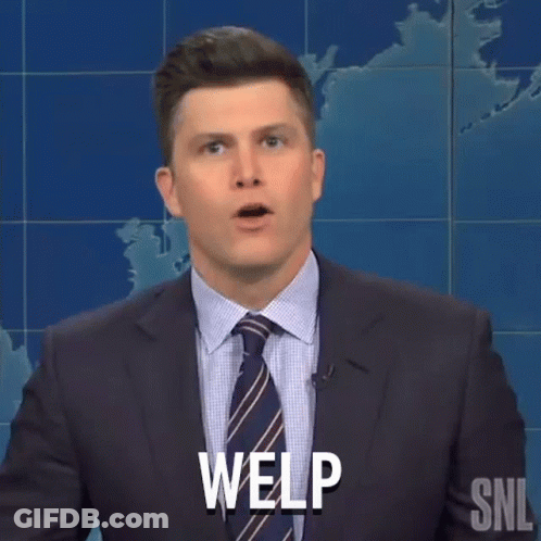 A Man In A Suit And Tie Is Making A Funny Face And Saying Welp . GIF