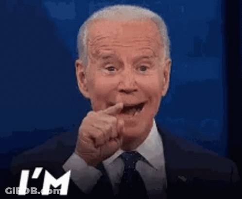 A Man In A Suit And Tie Is Making A Funny Face And Says I 'M GIF