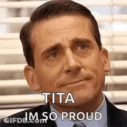 A Man In A Suit And Tie Is Making A Funny Face And Says `` Tita Im So Proud '' . GIF