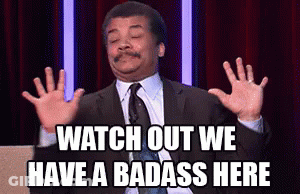 A Man In A Suit And Tie Is Making A Funny Face And Says Watch Out We Have A Badass Here . GIF