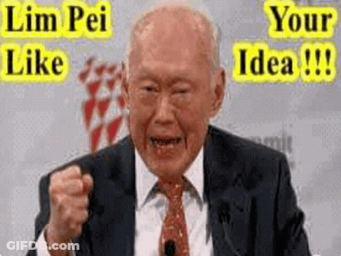 A Man In A Suit And Tie Is Making A Funny Face While Giving A Speech . GIF