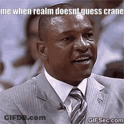 A Man In A Suit And Tie Is Making A Funny Face While Talking On A Microphone . GIF