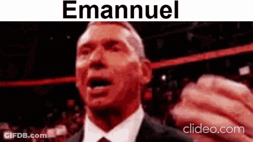 A Man In A Suit And Tie Is Making A Funny Face With The Name Emanuel On The Bottom . GIF