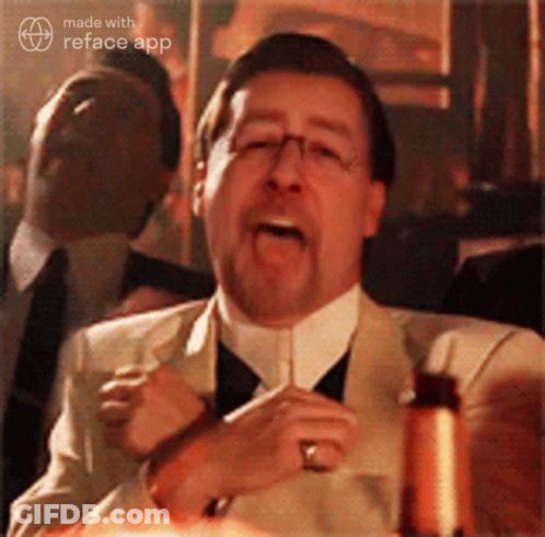 A Man In A Suit And Tie Is Making A Funny Face With The Reface App GIF