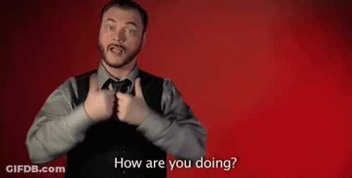 A Man In A Suit And Tie Is Making A Gesture With His Hands And Asking How Are You Doing . GIF