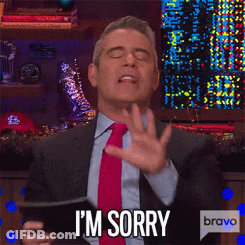 Man In Suit Making Sorry Gesture With Phone GIF